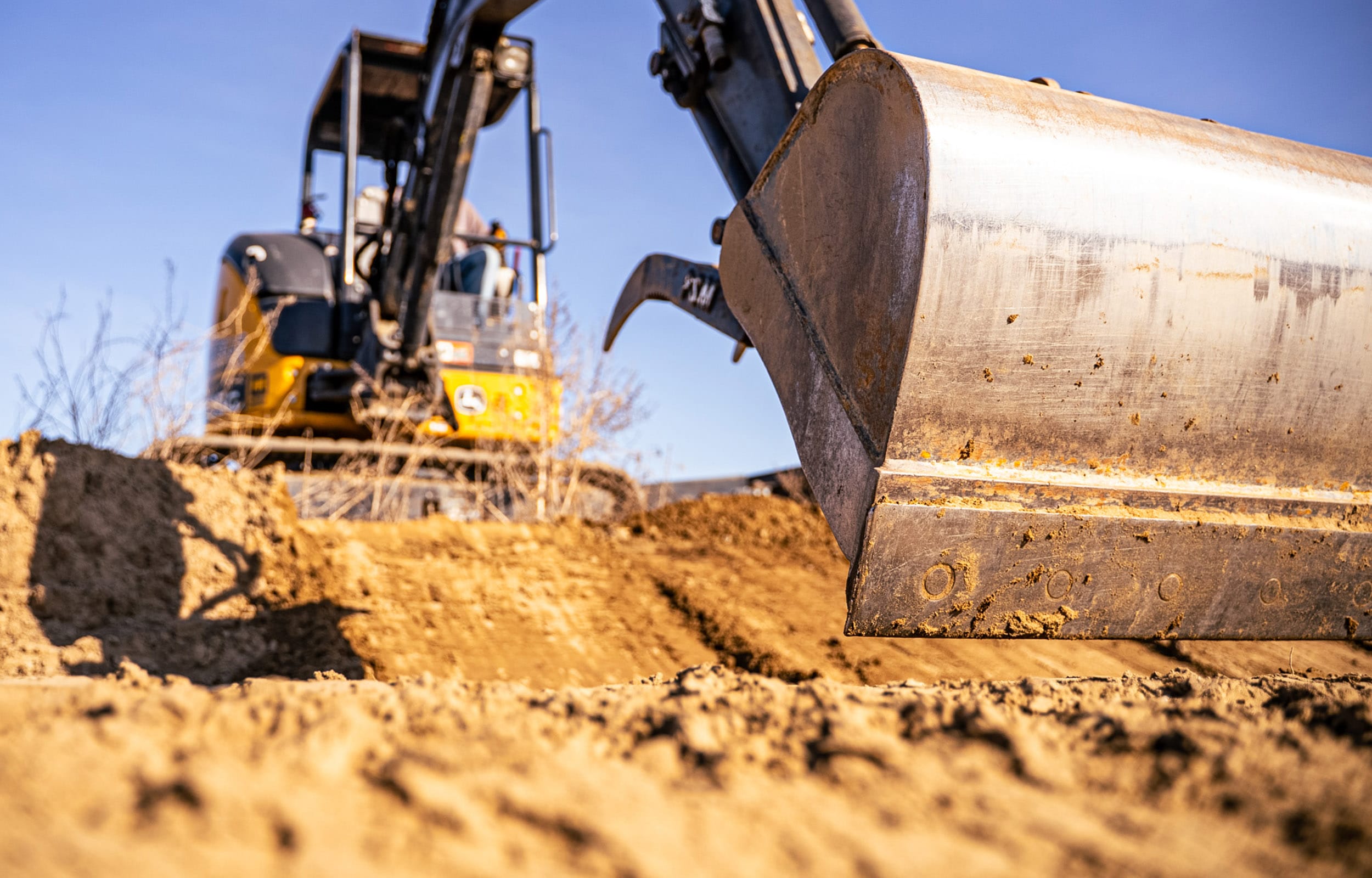 VBX-Excavating-Hero-BG_0005_VBX_Sutton Trucking Job_02.2.27.2025-03094 bulldozer scooping dirt