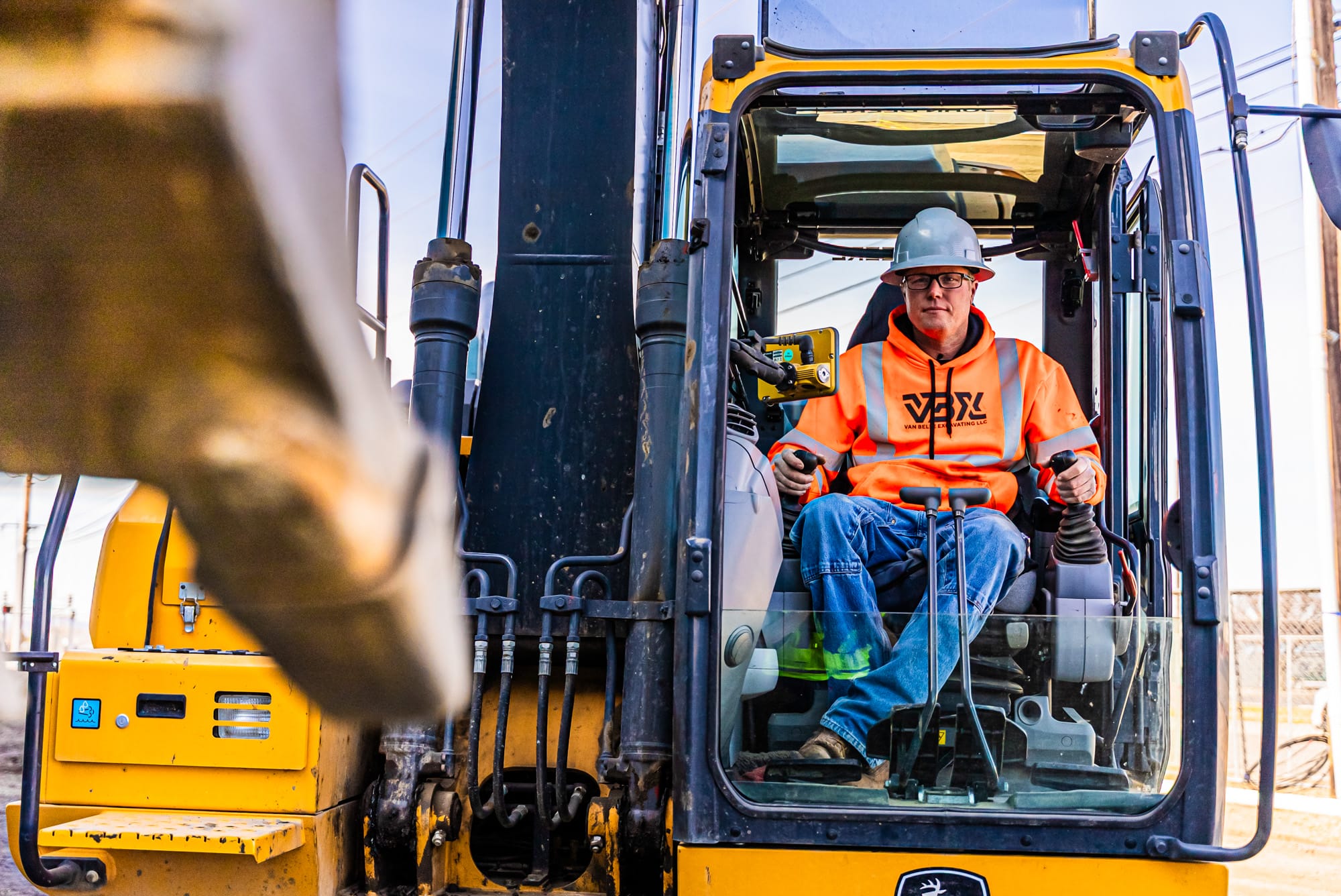 VBX_Website Shoot_03.2025-04202 VBX employee driving an excavator