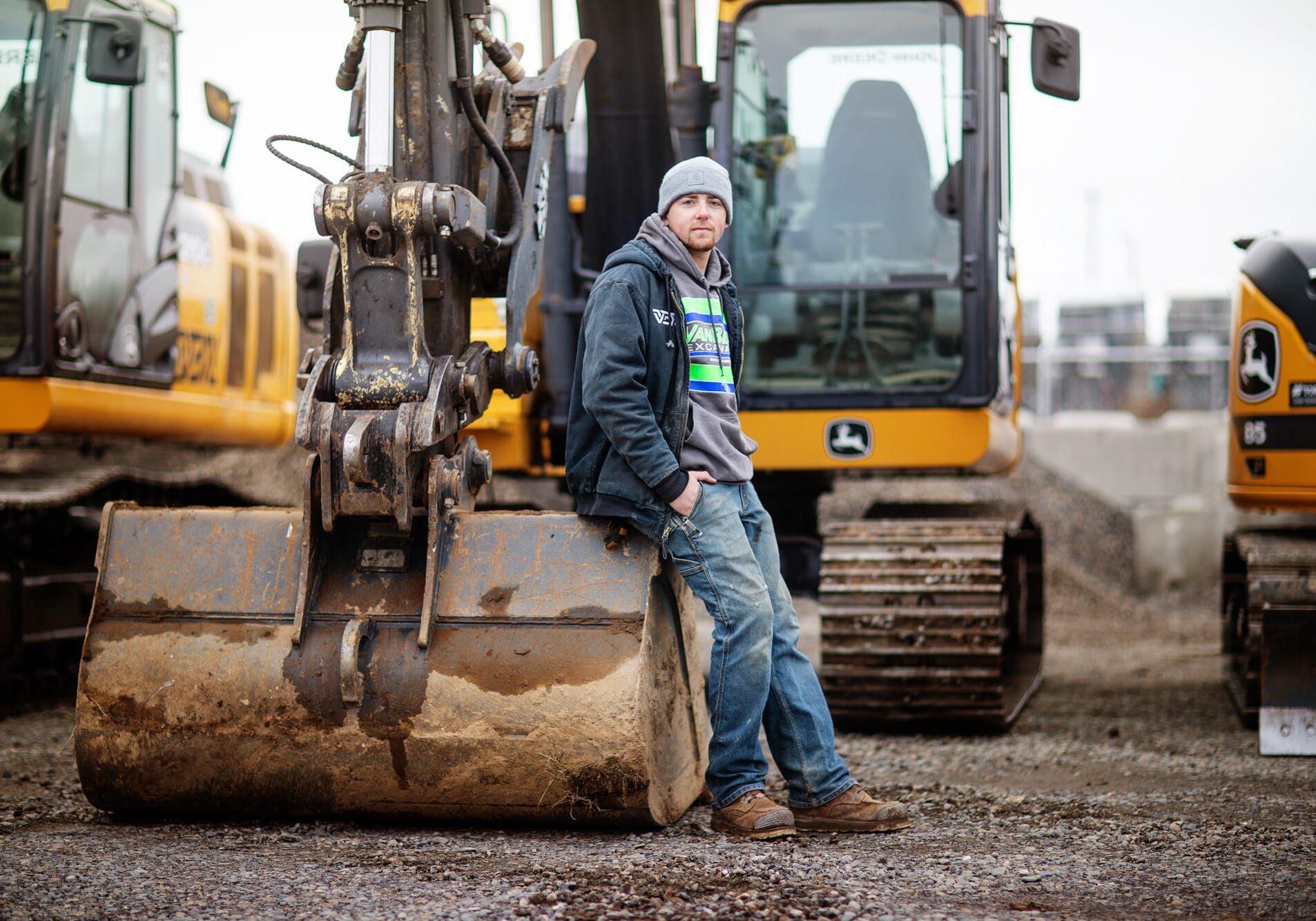 3F2A7415 VBX team member leaning on an excavator scoop